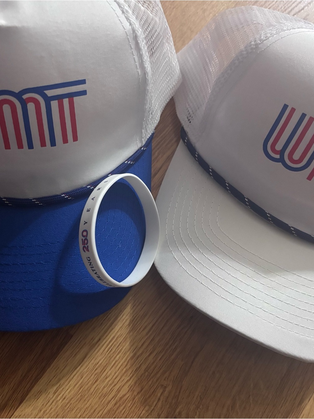 White & Blue Trucker Hats with Red & Blue Logo